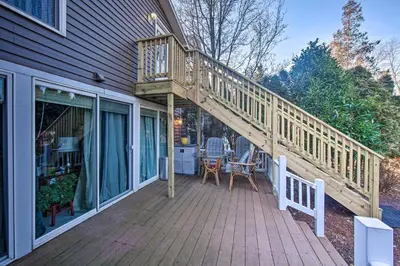 a wooden deck with a staircase on the side of a house at Central Hummelstown Apt 4 Miles to Hershey Park! in Hummelstown