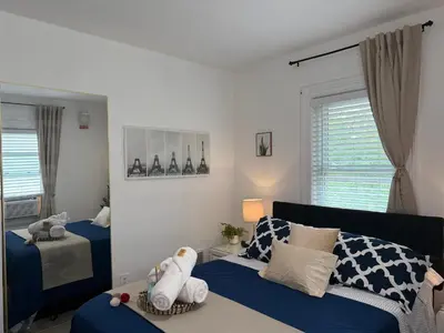 a bedroom with two beds with stuffed animals on it at Cozy Private bedrooms Kitchen Wifi in Englewood