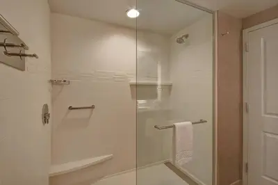 a bathroom with a shower with a glass door at Residence Inn Middletown Goshen in Middletown