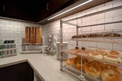 a bakery with shelves of donuts and other pastries at Residence Inn Middletown Goshen in Middletown