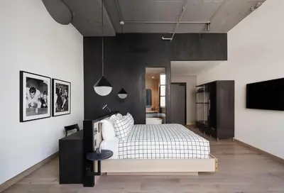 a bedroom with a white bed and black walls at Fitler Club in Philadelphia
