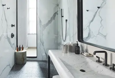 a white bathroom with a sink and a mirror at Fitler Club in Philadelphia