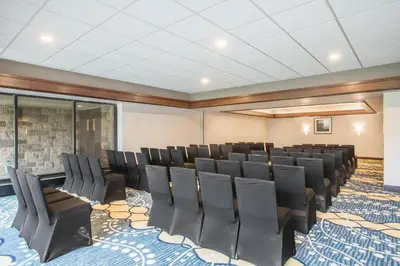 a conference room with black chairs in it at Crowne Plaza Princeton - Conference Center by IHG in Princeton