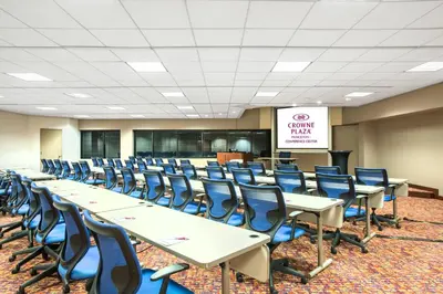 a conference room with rows of tables and chairs at Crowne Plaza Princeton - Conference Center by IHG in Princeton