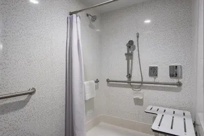 a bathroom with a shower and a sink at Crowne Plaza Princeton - Conference Center by IHG in Princeton