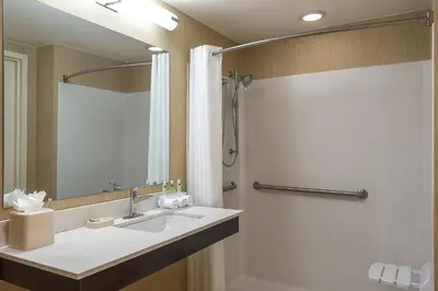a bathroom with a sink and a shower at Crowne Plaza Princeton - Conference Center by IHG in Princeton