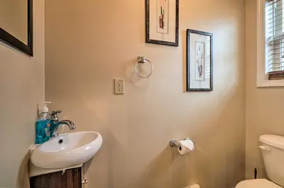 a bathroom with a sink and a toilet at 6 Mi to Skiing Family Poconos Home w Decks! in Albrightsville