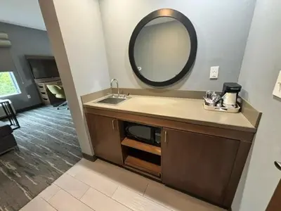 a bathroom with a sink and a mirror at Hampton Inn & Suites Deptford, Nj in Deptford