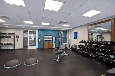 a room with a gym with a lot of equipment at Hampton Inn & Suites Deptford, Nj in Deptford
