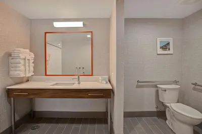 a bathroom with a sink and a toilet at Hampton Inn & Suites Deptford, Nj in Deptford
