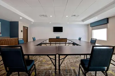 a conference room with a large table and chairs at Hampton Inn & Suites Deptford, Nj in Deptford