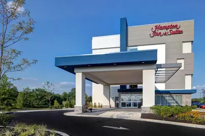 a building with a parking lot in front of it at Hampton Inn & Suites Deptford, Nj in Deptford