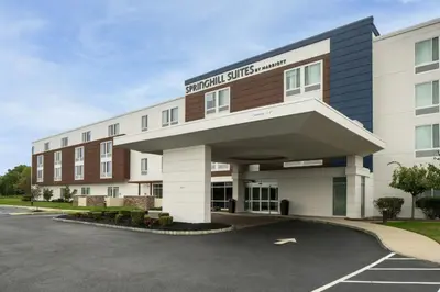 a front view of a hotel with a parking lot at SpringHill Suites by Marriott Voorhees Mt. Laurel/Cherry Hill in Voorhees