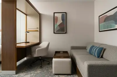 a living room with a couch and a desk at SpringHill Suites by Marriott Voorhees Mt. Laurel/Cherry Hill in Voorhees