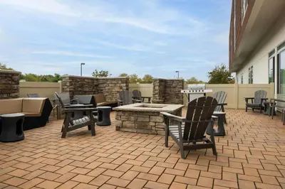 a patio with chairs and tables and a fire pit at SpringHill Suites by Marriott Voorhees Mt. Laurel/Cherry Hill in Voorhees