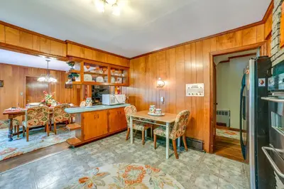 a kitchen and dining room with a table and chairs at Serene Home with On-Site Brook in Callicoon Center in Callicoon Center