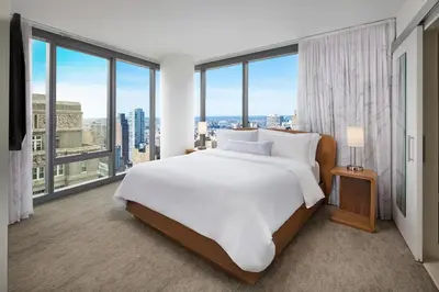 a bedroom with a large bed and large windows at Element Philadelphia Downtown in Philadelphia