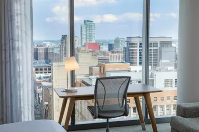 a desk and chair in a room with a large window at Element Philadelphia Downtown in Philadelphia