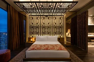a bedroom with a bed and a large window at W Philadelphia in Philadelphia