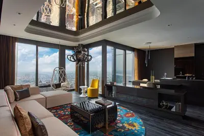 a living room with a couch and a table at W Philadelphia in Philadelphia