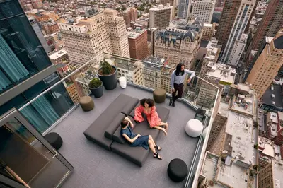 two people sitting on the floor of a building at W Philadelphia in Philadelphia