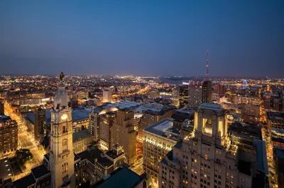 a view of a city at night with a clock tower at W Philadelphia in Philadelphia