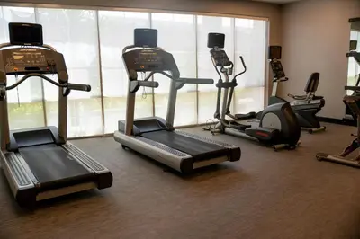 a gym with several exercise bikes and tread machines at Courtyard by Marriott Philadelphia Springfield in Springfield
