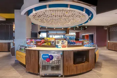 a food counter in a store with a soda machine at Tru By Hilton Grantville, Pa in Grantville