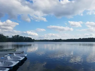 a group of boats sitting on a large lake at Tru By Hilton Grantville, Pa in Grantville