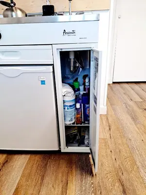 a refrigerator with its door open in a kitchen at Fairway Paradise tiny home in Lancaster
