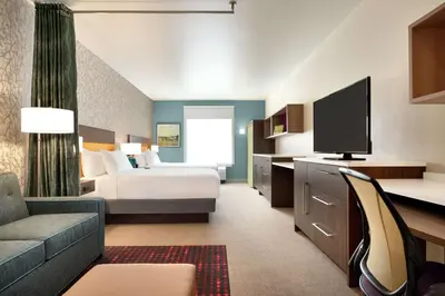 a hotel room with a bed and a tv at Home2 Suites By Hilton Ephrata in Ephrata