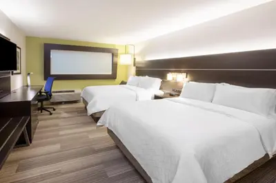 a hotel room with two beds and a flat screen tv at Holiday Inn Express & Suites - Harrisburg S - Mechanicsburg by IHG in Mechanicsburg
