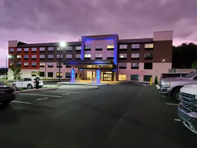 a parking lot in front of a large building at Holiday Inn Express & Suites - Harrisburg S - Mechanicsburg by IHG in Mechanicsburg