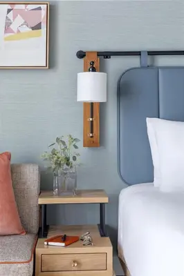 a bedroom with a bed and a table with a lamp at Hyatt Centric Rittenhouse Square Philadelphia in Philadelphia