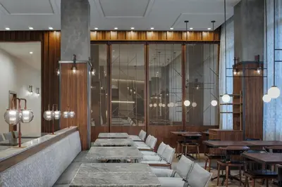 a restaurant with tables and chairs and a row of tables at Hyatt Centric Rittenhouse Square Philadelphia in Philadelphia