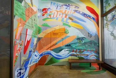 a mural in a room with a bench at Hyatt Centric Rittenhouse Square Philadelphia in Philadelphia
