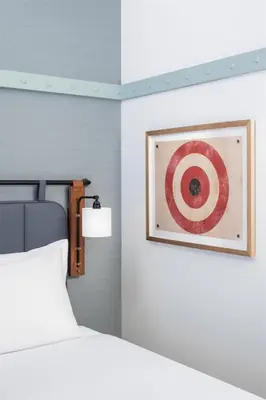 a bedroom with a bed and a picture on the wall at Hyatt Centric Rittenhouse Square Philadelphia in Philadelphia