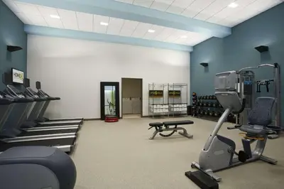 a gym with exercise equipment in a room at Home2 Suites by Hilton Philadelphia Convention Center in Philadelphia