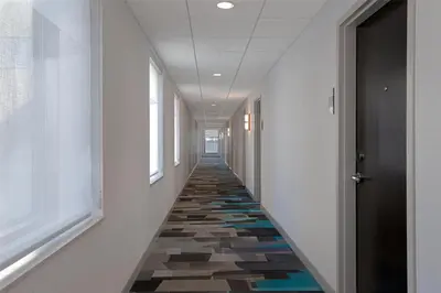 a hallway with a colorful tile floor in a building at Home2 Suites by Hilton Philadelphia Convention Center in Philadelphia