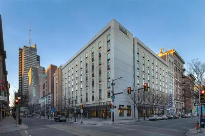 a large white building on a city street at Home2 Suites by Hilton Philadelphia Convention Center in Philadelphia