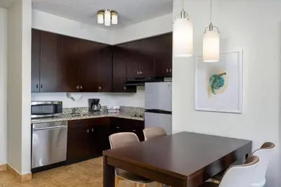 a kitchen with a table and chairs in a room at TownePlace Suites by Marriott York in York