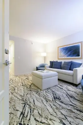 a living room with a couch and a table at Mohegan Pennsylvania Casino Resort - Adults Only in Wilkes-Barre