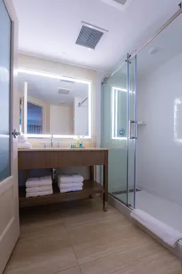 a bathroom with a sink and a shower at Mohegan Pennsylvania Casino Resort - Adults Only in Wilkes-Barre