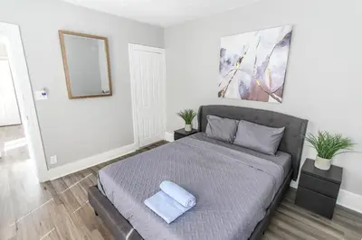 a bedroom with a bed with a blue towel on it at ☆☆ Modern Coed Dorm in Reading ☆☆ in Reading