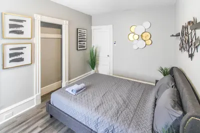 a bedroom with a bed and a couch at ☆☆ Modern Coed Dorm in Reading ☆☆ in Reading