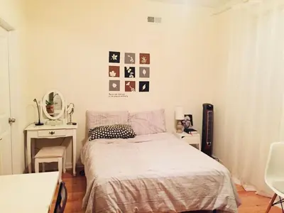 a bedroom with a bed and a table with a mirror at Cozy bedrooms at University City in Philadelphia in Philadelphia