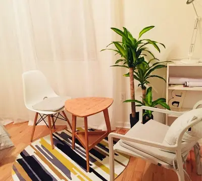 a room with a table and chairs and a plant at Cozy bedrooms at University City in Philadelphia in Philadelphia