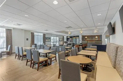 a dining room with tables and chairs at Best Western Plus Hershey in Hershey