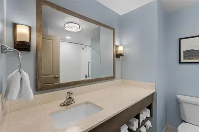 a bathroom with a sink and a mirror at Best Western Plus Hershey in Hershey