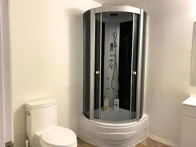 a bathroom with a shower with a white toilet at AF Stays - Philadelphia Convention Center in Philadelphia